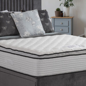 Apley Morgan 1000 Tencel Pillowtop Mattress with a quilted finish and Tencel fabric, displayed on a bed with decorative pillows in a stylish bedroom.