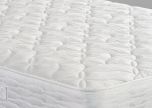 Image of close up of Remy mattress. The mattress shows its luxury quilted finish.