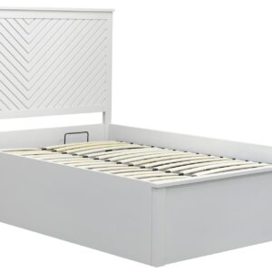 This image shows a painted bed with a chevron headboard and footboard. The bed has a built-in ottoman, which is open and showing the storage space inside. The image is taken in a bedroom setting.