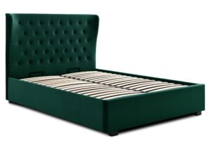 This image shows a king-size Kensington Ottoman Bed Velvet from Apleybeds.co.uk. The bed is upholstered in a luxurious soft bottle velvet and has a softly winged headboard with Chesterfield-style button tufting. The black block feet add a touch of sophistication. The end-opening ottoman lifts on easy-glide gas strut mechanisms to reveal a spacious storage compartment. This bed is the perfect choice for anyone who wants a stylish, comfortable, and practical bedroom. It is made in the UK with care and attention to detail, and you can be sure of its quality. Order your Kensington Ottoman Bed Velvet today and enjoy a luxurious night's sleep.
