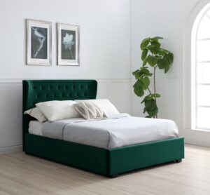 This image shows a king-size Kensington Ottoman Bed Velvet from Apleybeds.co.uk. The bed is upholstered in a luxurious soft bottle velvet and has a softly winged headboard with Chesterfield-style button tufting. The black block feet add a touch of sophistication. The end-opening ottoman lifts on easy-glide gas strut mechanisms to reveal a spacious storage compartment.
