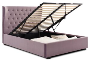 This image shows a king-size Kensington Ottoman Bed Velvet from Apleybeds.co.uk. The bed is upholstered in a luxurious soft heather velvet and has a softly winged headboard with Chesterfield-style button tufting. The black block feet add a touch of sophistication. The end-opening ottoman lifts on easy-glide gas strut mechanisms to reveal a spacious storage compartment.