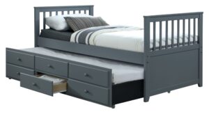 This image shows a captain bed with a trundle and storage drawers. The bed is made of wood and has a white finish. The headboard is tall and has a curved top. The trundle bed is located underneath the main bed and can be pulled out for extra sleeping space. The storage drawers are located at the foot of the bed and provide additional storage space.
