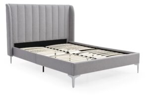 This image shows a king-size Avery bed from Apleybeds.co.uk. The bed is made of solid wood and has a classic and timeless design. The headboard is tall and has a curved top. The bed is upholstered in a luxurious soft grey faux wool fabric. This bed is perfect for anyone who wants a stylish, practical, and comfortable bed for their bedroom. The solid wood construction of the bed makes it sturdy and durable, while the upholstered headboard adds a touch of luxury. The bed is also very versatile and can be dressed up or down to fit any style of bedroom.