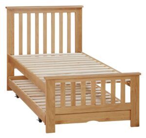 This image shows a single bed frame made of solid oak from Apley Beds. The bed has a simple design with a straight headboard and footboard. The bed is finished in a natural oak stain. The image also shows a nightstand next to the bed. The nightstand is made of the same solid oak as the bed frame. The nightstand has a drawer and a shelf. The bed is available in a variety of sizes and finishes. The Eden guest bed is a versatile and stylish piece of furniture that would be perfect for any bedroom.