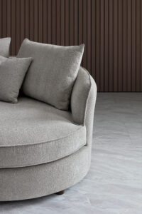 Close-up view of the Rubin Corner Sofa showcasing the textured Pebble Bouclé fabric and soft cushions.