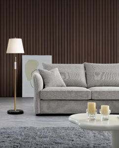 Side view of the Rubin Corner Sofa in a modern setting with a floor lamp and minimalist decor.