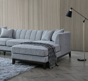 Side view of the Cooper sofa showcasing its sleek lines and Dolphin Bouclé upholstery.