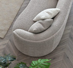 op view of the Nolita sofa showcasing its curvaceous design and luxurious Koala & Latte Bouclé upholstery.
