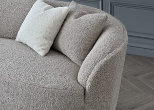 Detailed shot of the Nolita sofa's arm in Koala Bouclé showcasing the texture and plush design.