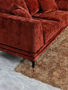 Close-up of Lenox Sofa in Rust Velvet with high-rise boxy arms