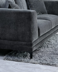 Close-up of Lenox Sofa in Steel Velvet with high-rise boxy arms