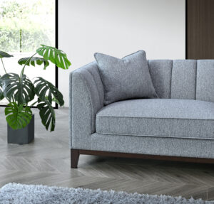 Close-up of the Cooper 3 Seater Sofa in Dolphin Boucle with plant decoration