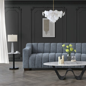Aluxo Astoria 3 seater modern Chesterfield sofa in Iron bouclé in a dark panelled living room with a marble coffee table
