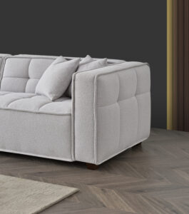 Side view of the Murray Sofa in Putty Boucle fabric with dark wooden feet
