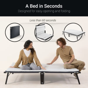 A couple sits on a Jay-Be folding bed, showing the easy setup process from folding to full bed in less than 60 seconds.