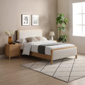 A modern bedroom with a cream linen-upholstered bed frame, featuring a wooden structure, placed in a bright room with a minimalist design.