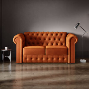 Chesterfield 2 Seater Sofa Bed in warm orange fabric with deep button tufting and rolled arms.