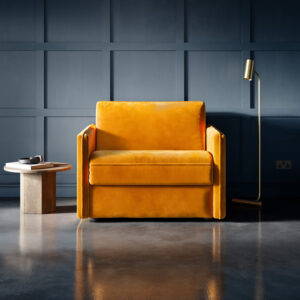 Slim Snuggler Sofa Bed in saffron velvet fabric, with a compact design and luxurious feel, placed in a modern, stylish room.