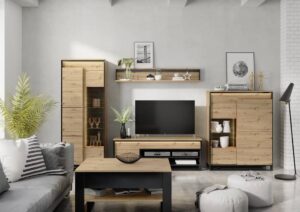 Modern living room setup featuring the Quant furniture collection, including a wall shelf, TV cabinet, and storage units in Oak Artisan and Black finishes.