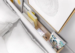 Overhead view of the Dentro Bed’s headboard shelf, neatly storing books, a phone, and decorative accents.