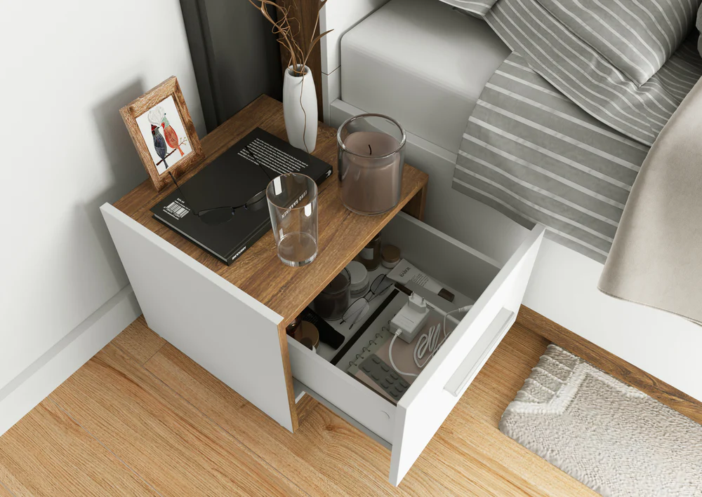 Dentro Bedside Cabinet in White Matt & Oak Sterling with an open drawer revealing neatly stored essentials.