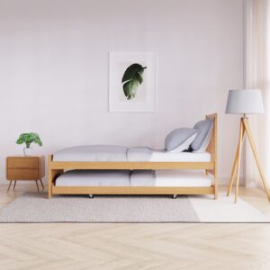Natural wood guest bed shown with the trundle fully extended and both mattresses set up for use.
