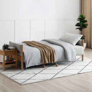 The Quinn Sofabed laid flat in sleeping position, showing its easy click-clack mechanism and full sleeping surface.