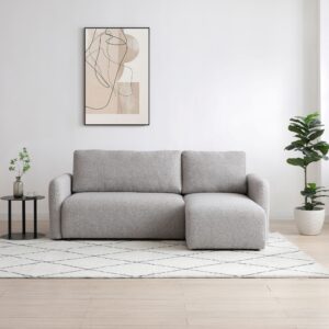 Cloud Corner Sofa Bed in boucle fabric shown in a modern, naturally lit living room with soft styling and minimalist décor.