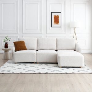 Como 3 Seater Modular Sofa in natural boucle fabric with chaise, modern design, and plush deep seating on a patterned rug in a bright living room.