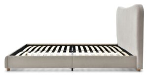 Side profile of the Mollie bed in a box showing the curved upholstered headboard and slatted base