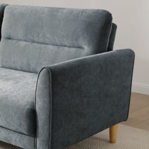 Close-up of the arm, chenille weave and wooden leg on the Harvey Sofa Bed in denim