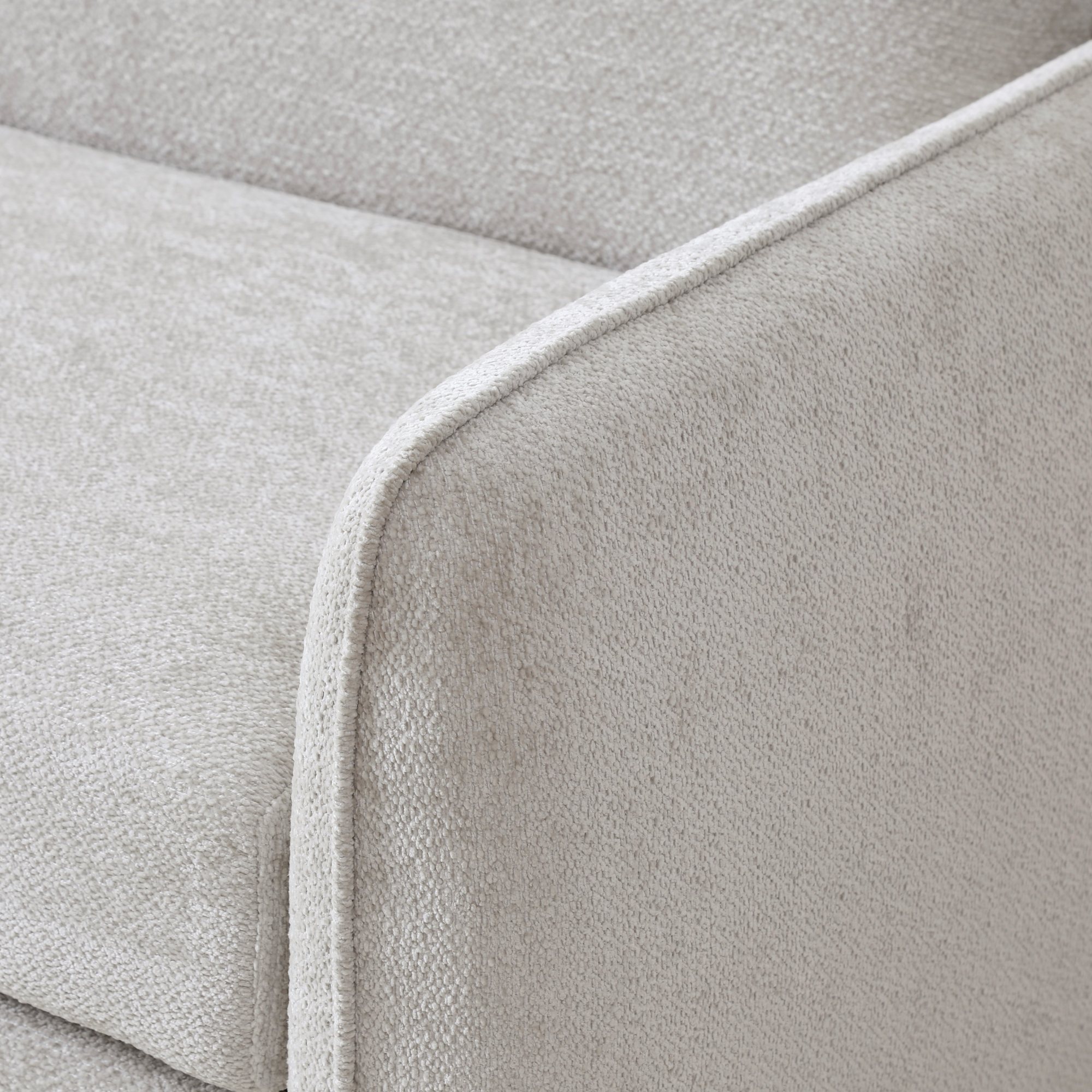 Close-up of the piped arm and chenille weave on the Millie Sofa Bed in natural