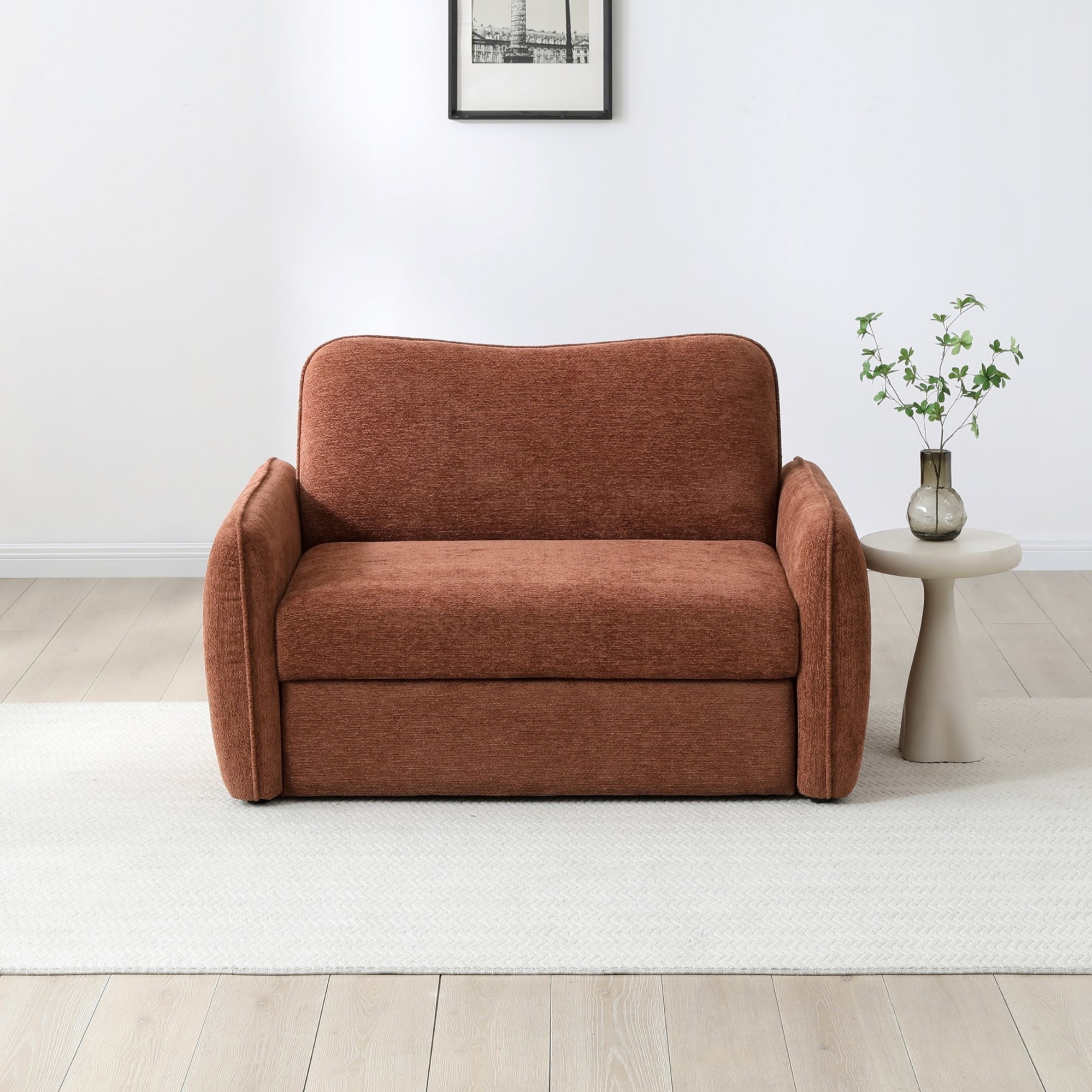 Millie small 2 seater sofa bed in Mercury Orange soft chenille in a compact living room