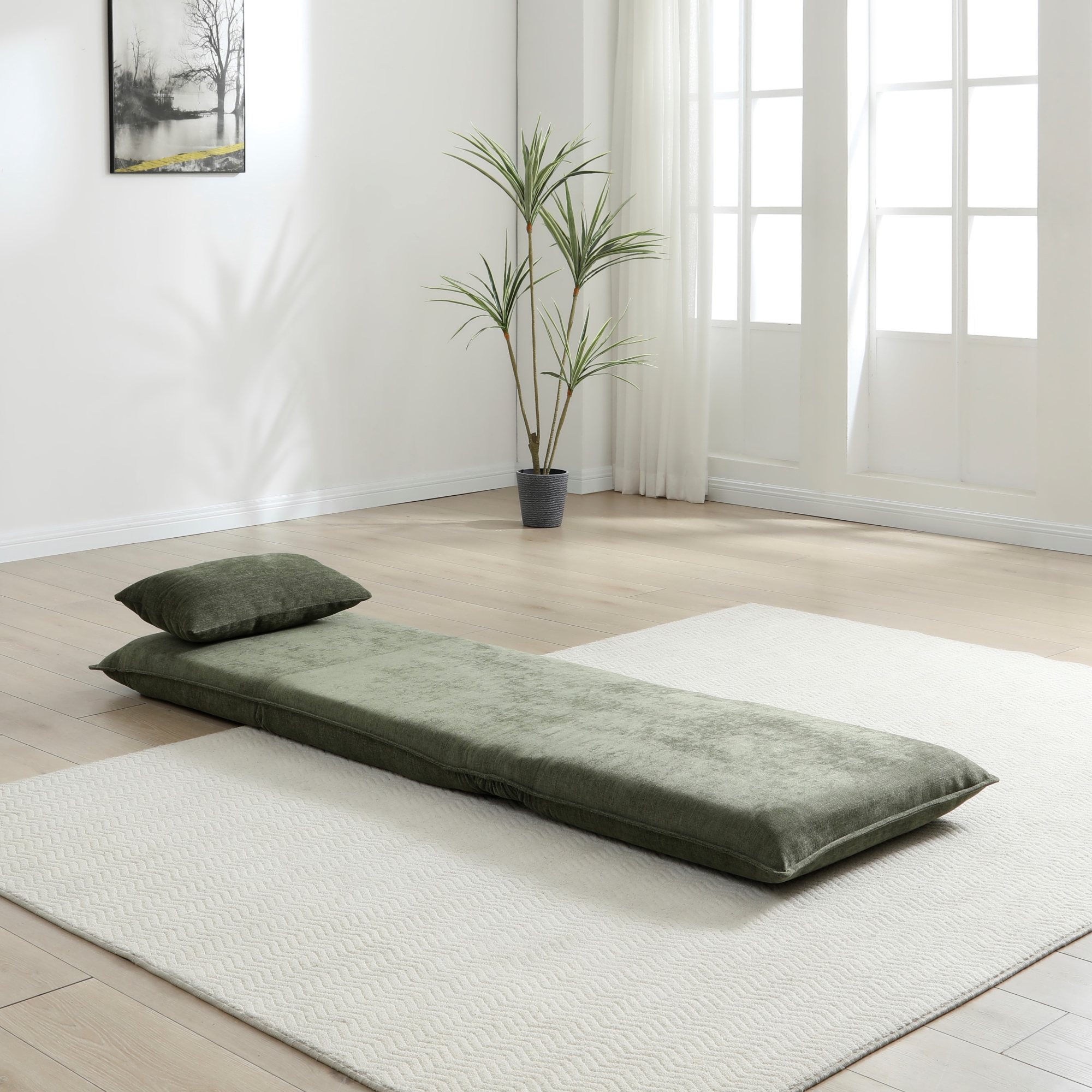 Carter Sofa Bed in Dionysus Olive chenille laid flat as a bed in a living room