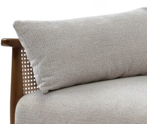 Close-up of the seat cushion against the natural cane rattan arm on the Zara Sofa Bed