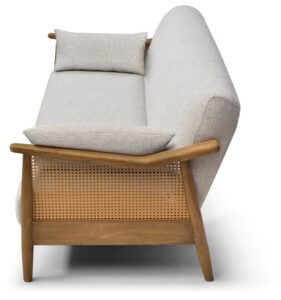 Zara Rattan Arm Sofa Bed at an angle with the headrest cushion raised