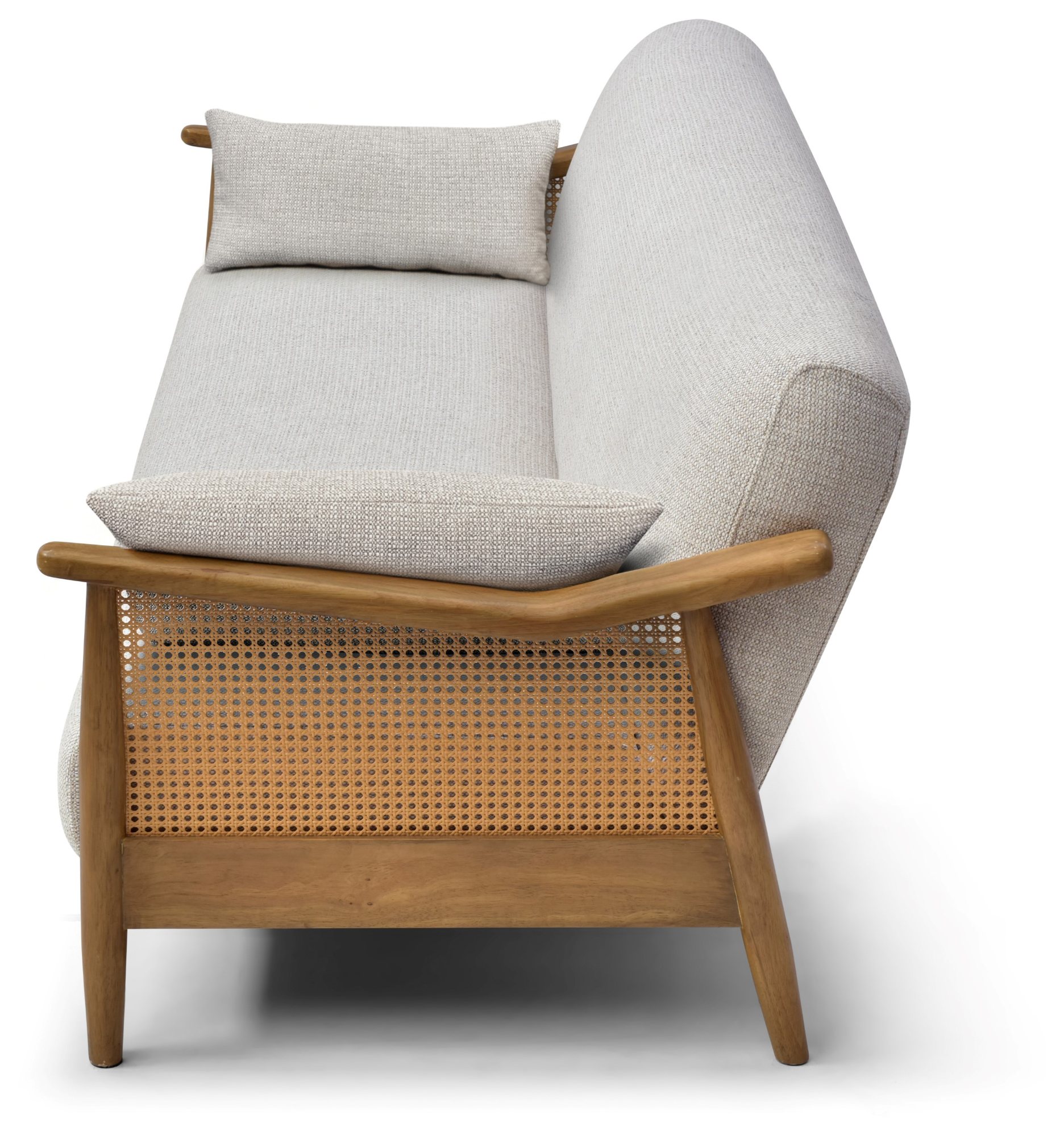 Zara Rattan Arm Sofa Bed at an angle with the headrest cushion raised