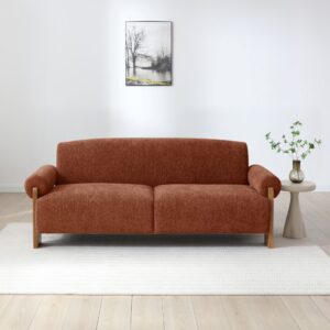 Mila Sofa Bed in Mercury Orange soft chenille in a living room with a side table
