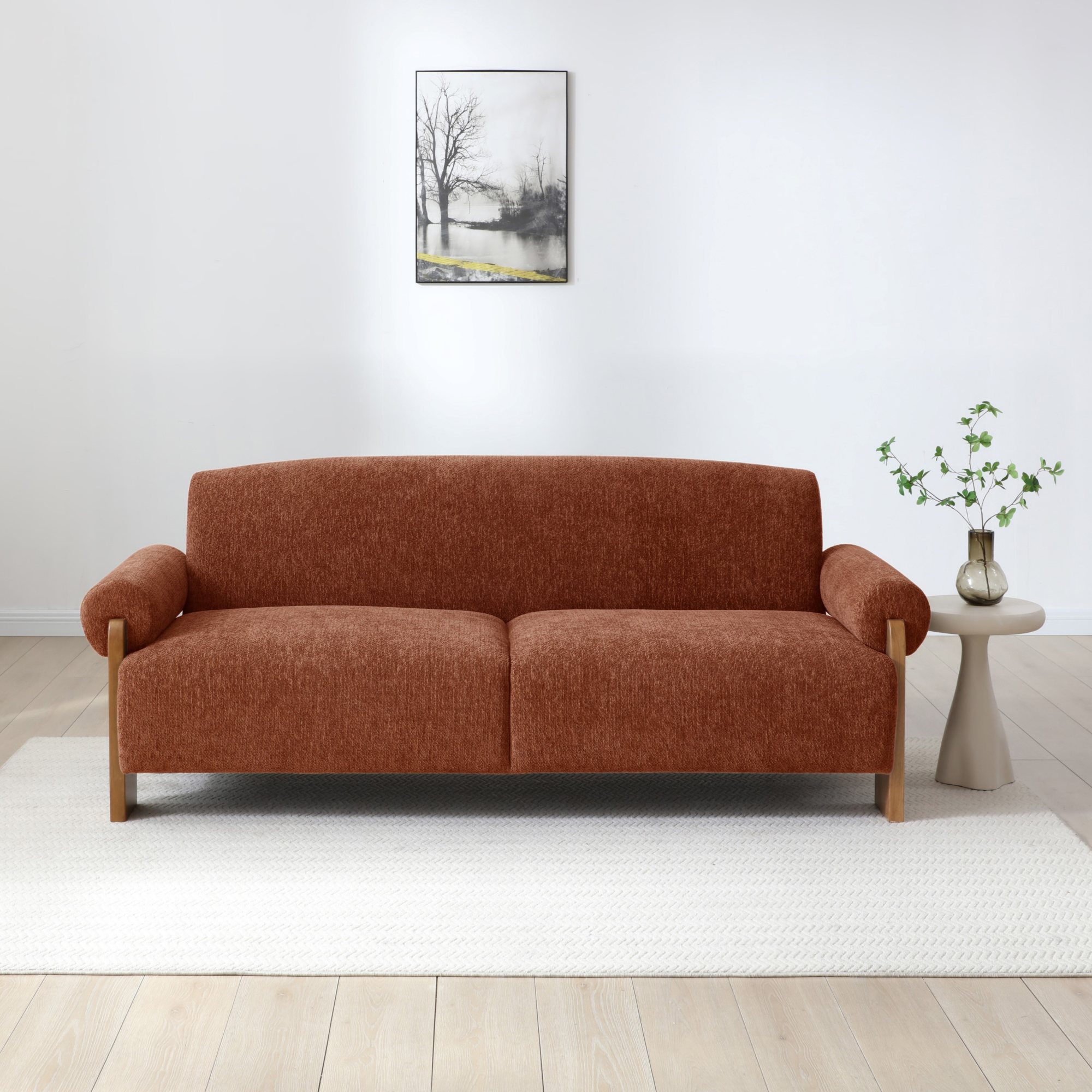Mila Sofa Bed in Mercury Orange soft chenille in a living room with a side table