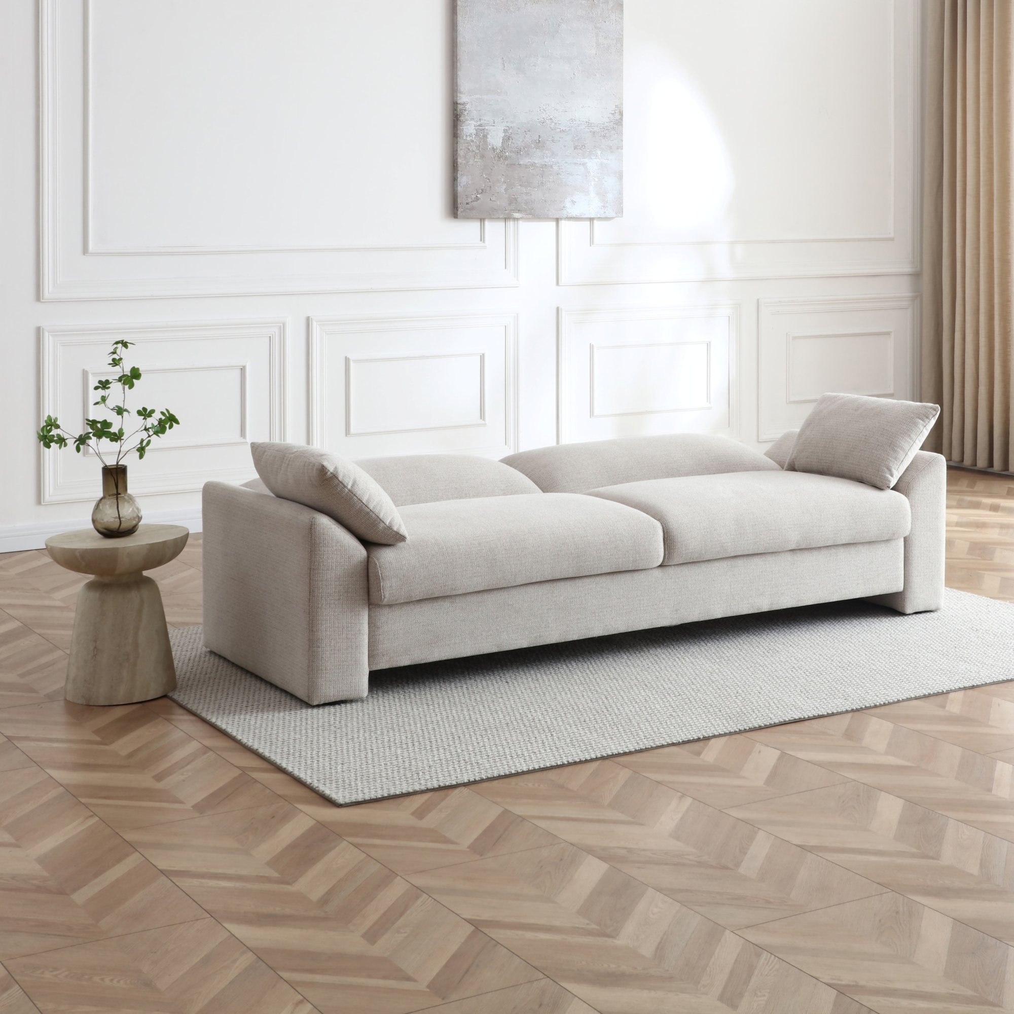 Evelyn Sofa Bed with the back folded flat into a three seater bed
