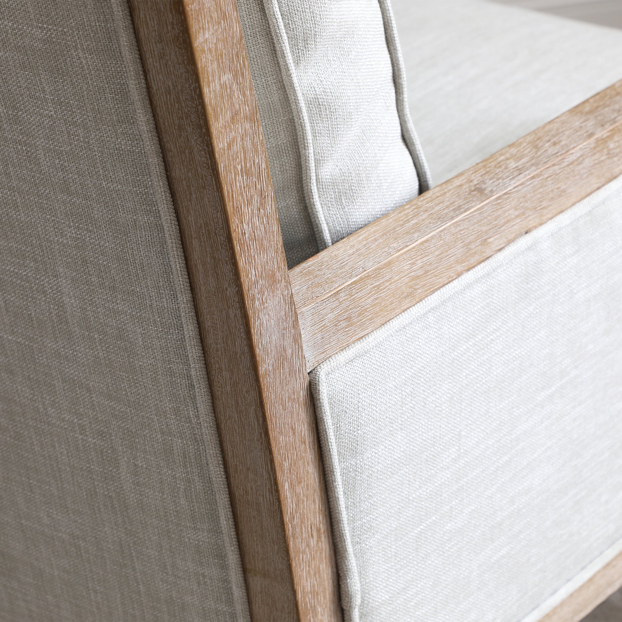 Washed wood frame detail on the Beatrice armchair