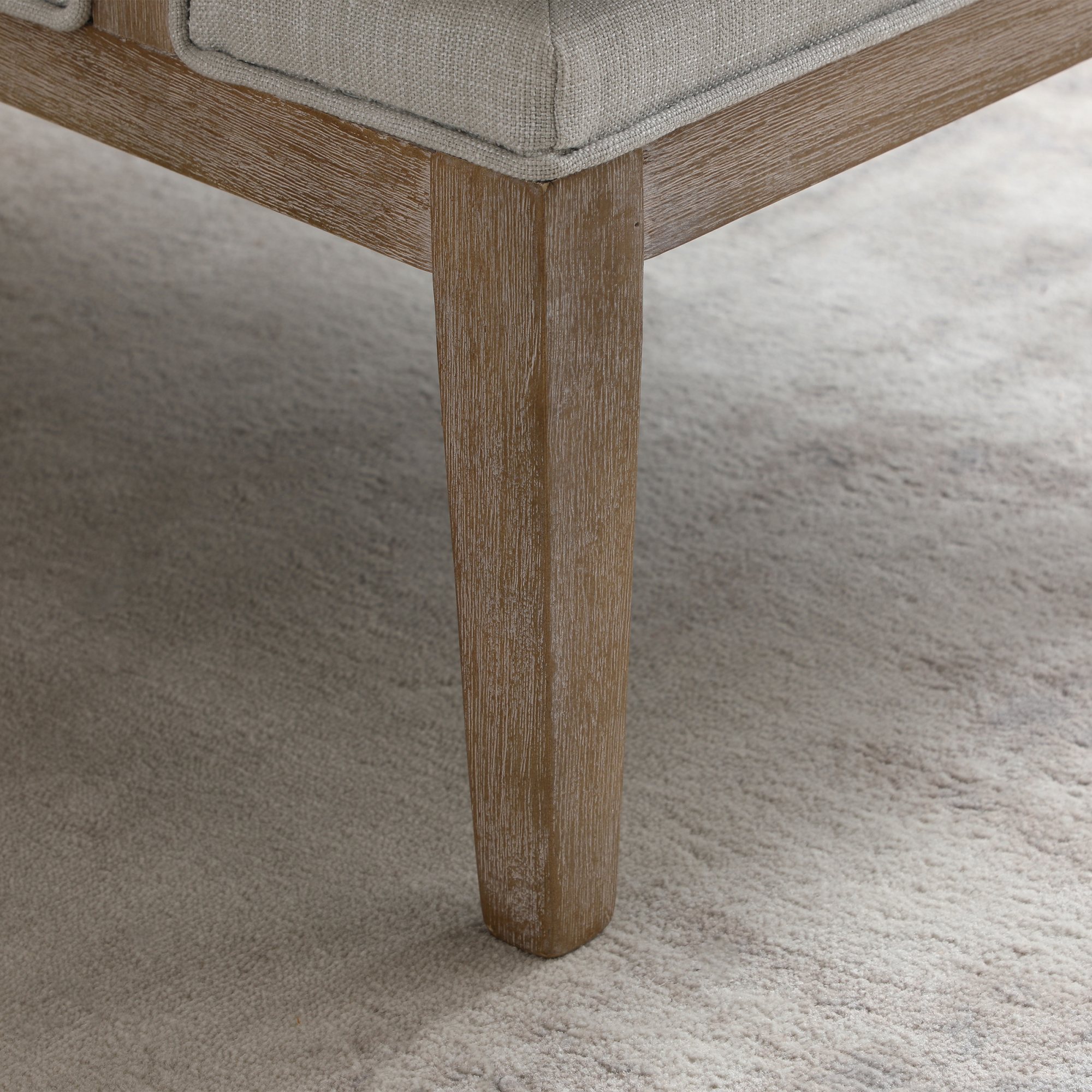 Piping detail along the arm of the Beatrice chair