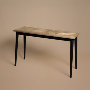Herringbone parquet detail along the console table top
