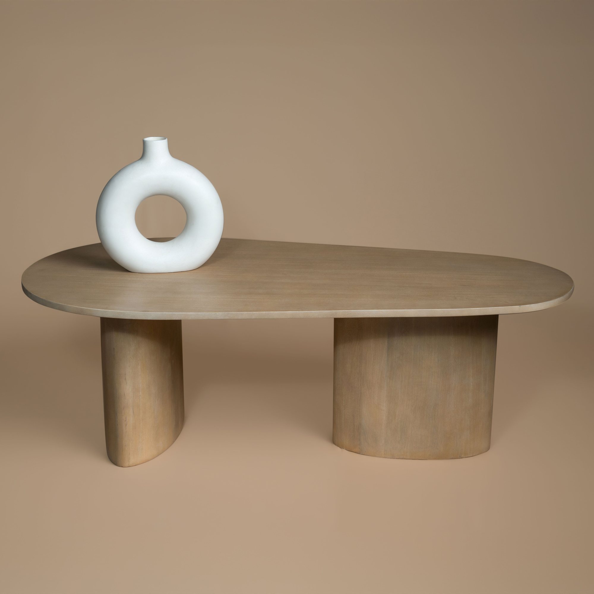 Sutton Coffee Table three-quarter view showing the wide oval legs