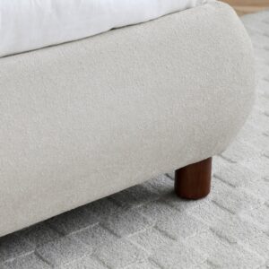 Headboard detail showing the softly rounded edge and boucle texture