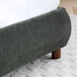 Close-up of the textured boucle upholstery on the Nora bed