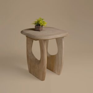 Casey Lamp Table in almond mango wood with sculpted cut-out legs and a small plant on top