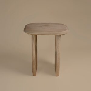 Casey Lamp Table in almond mango wood, three-quarter view showing the arched leg form