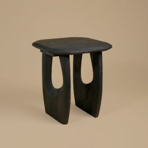 Casey Lamp Table in black mango wood with the sculpted cut-out leg form